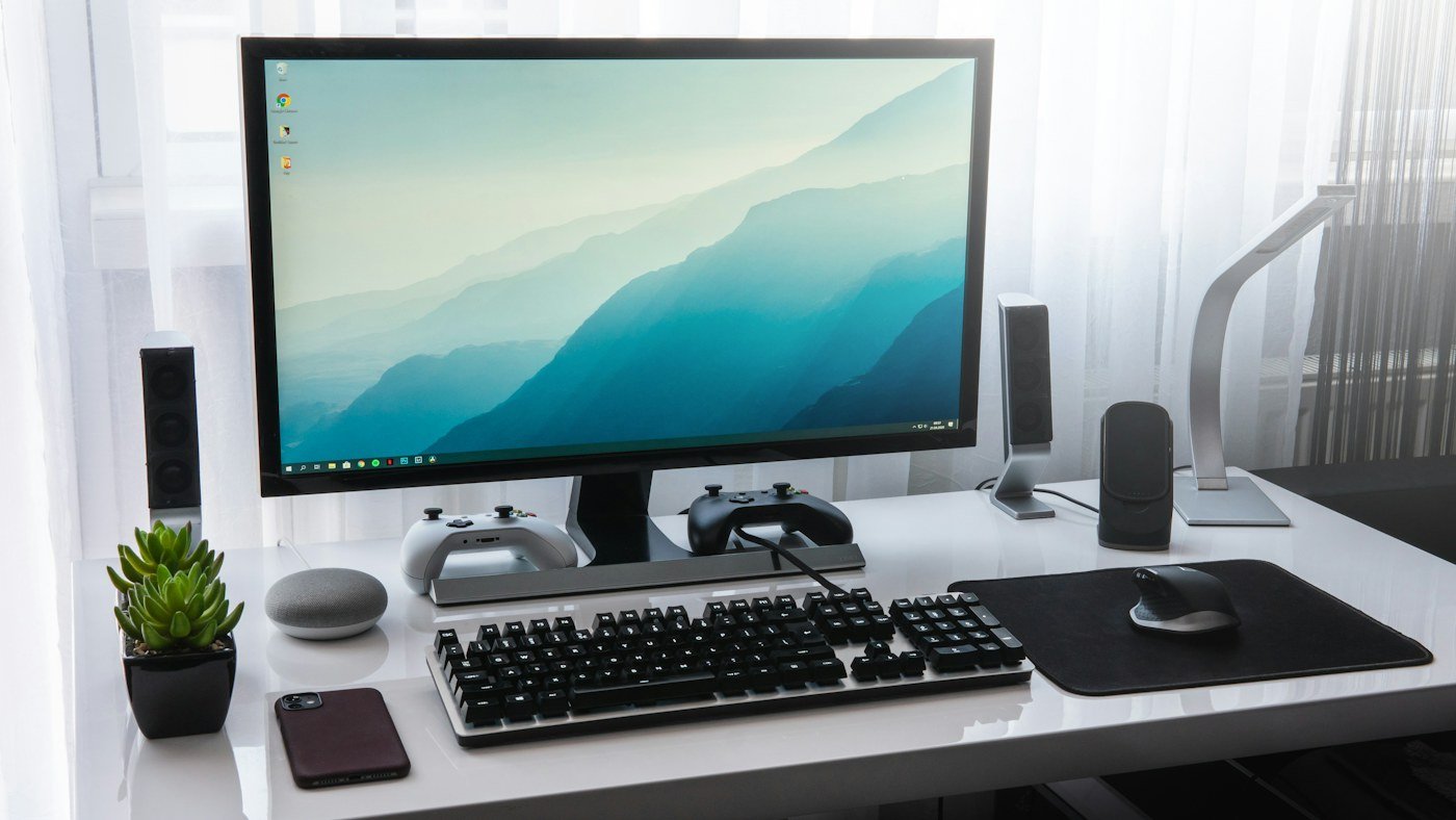 Desktop computer display in a minimal workstation setup