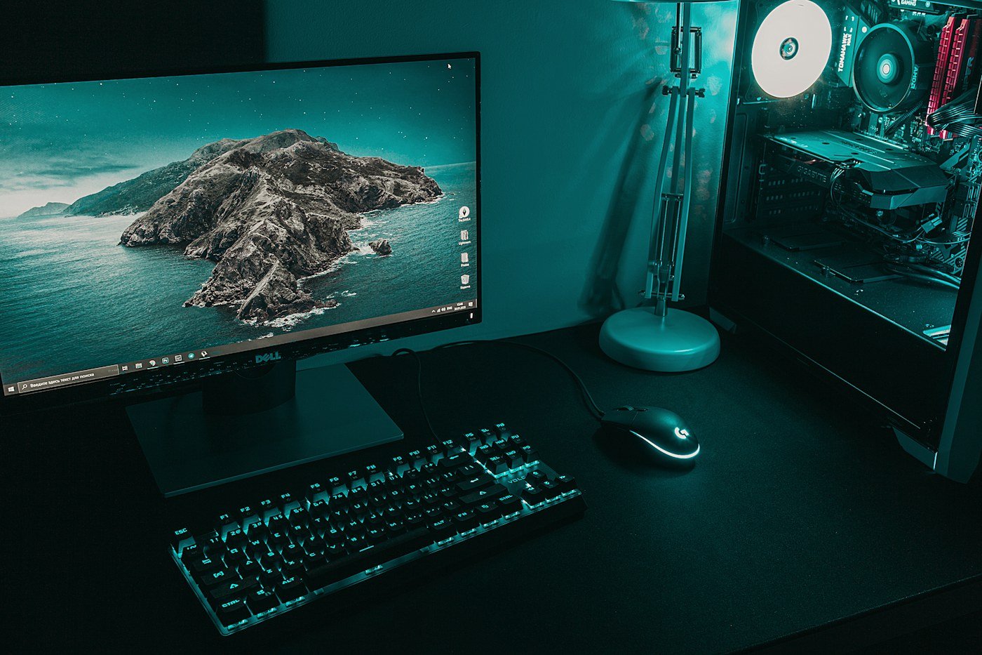 Flat-screen computer monitor and keyboard on a desk