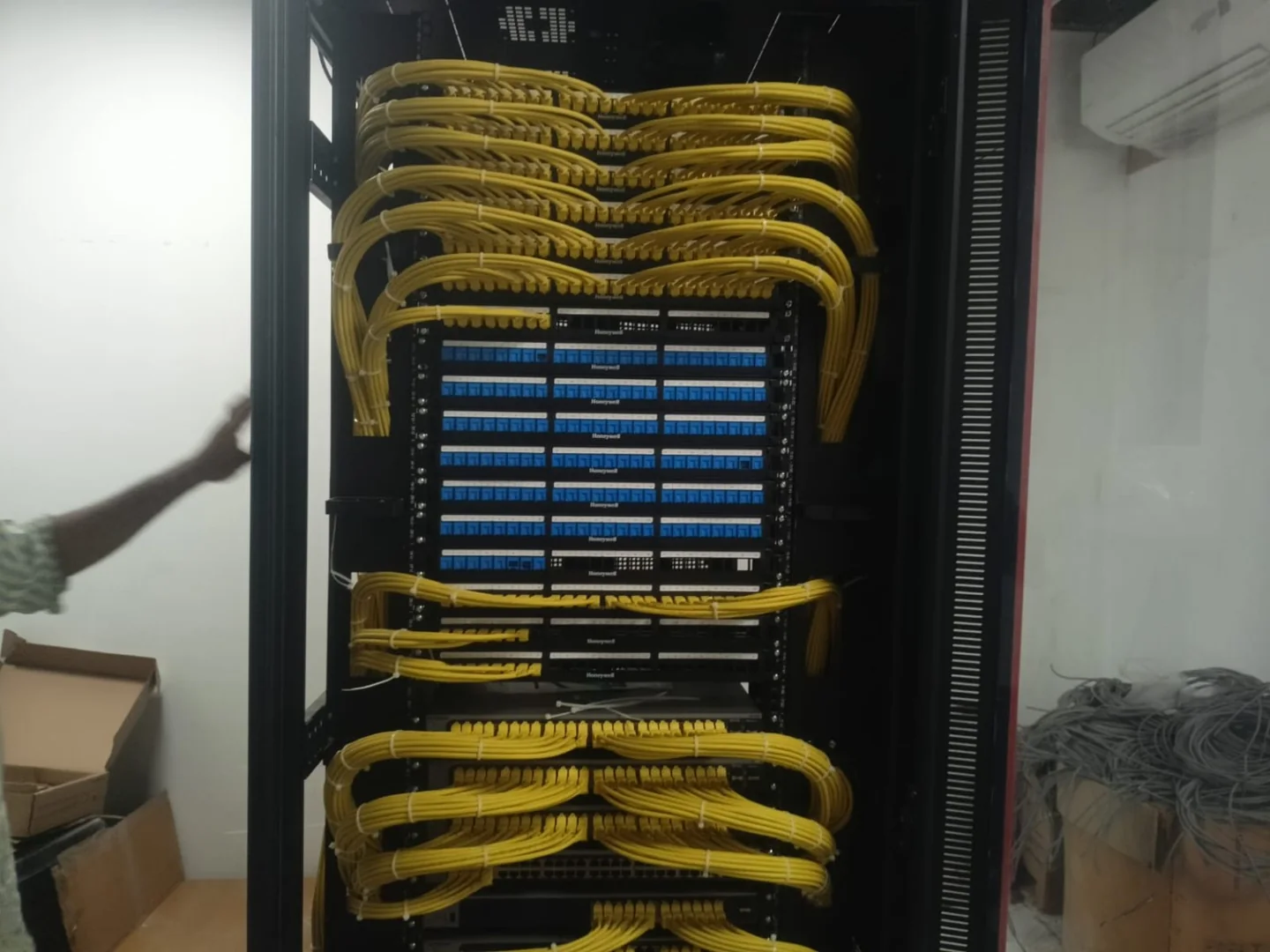 Actual front patch panels and yellow patch cords during APYS Projects work at Group Surya, Indapur